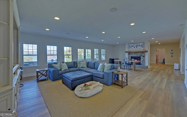 1951 Island View Dr, Hiawassee, GA 30546 - living area with baseboards, a fireplace, recessed lighting, and light wood-style floors