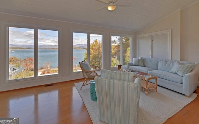 1951 Island View Dr, Hiawassee, GA 30546 - living room featuring healthy amount of natural light, wood finished floors, a ceiling fan, and vaulted ceiling