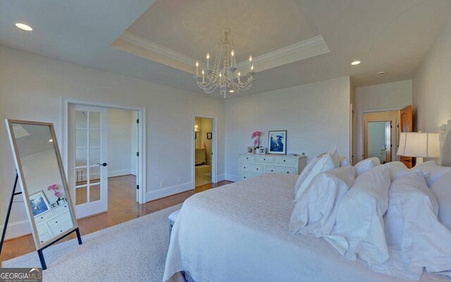 1951 Island View Dr, Hiawassee, GA 30546 - bedroom featuring crown molding, a tray ceiling, a chandelier, wood finished floors, and recessed lighting