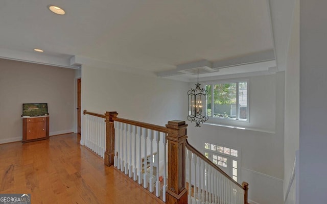 1951 Island View Dr, Hiawassee, GA 30546 - hall with an upstairs landing, wood finished floors, a chandelier, recessed lighting, and baseboards