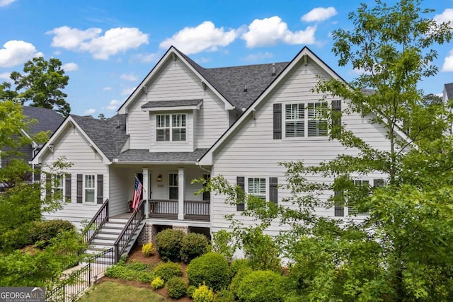 555 Red Bluff Dr, Athens, GA 30607 - traditional home featuring a porch, roof with shingles, and stairway
