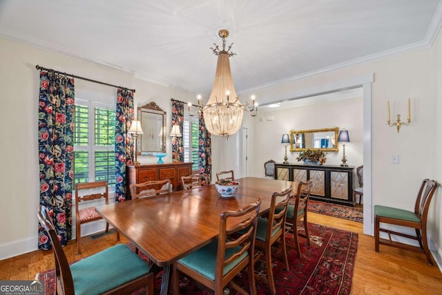 555 Red Bluff Dr, Athens, GA 30607 - dining space featuring a chandelier, ornamental molding, and wood finished floors