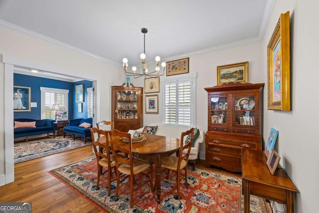 555 Red Bluff Dr, Athens, GA 30607 - dining room with ornamental molding, wood finished floors, and a chandelier