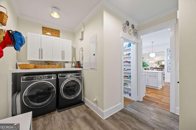 555 Red Bluff Dr, Athens, GA 30607 - washroom featuring washer and clothes dryer, wood finished floors, ornamental molding, and electric panel