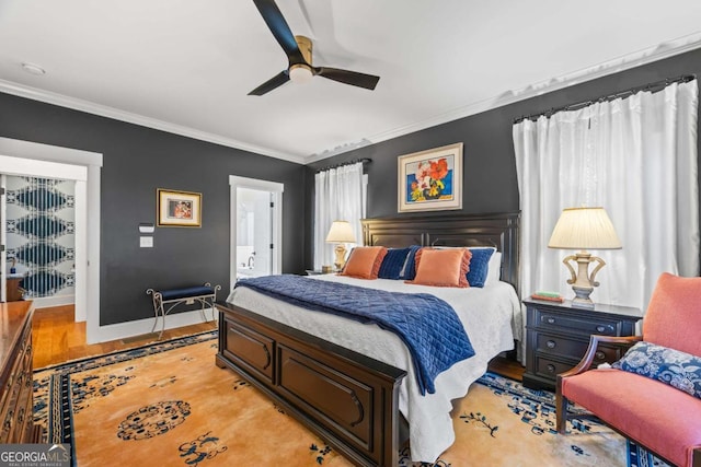 555 Red Bluff Dr, Athens, GA 30607 - bedroom featuring light wood-style floors, crown molding, ceiling fan, and connected bathroom