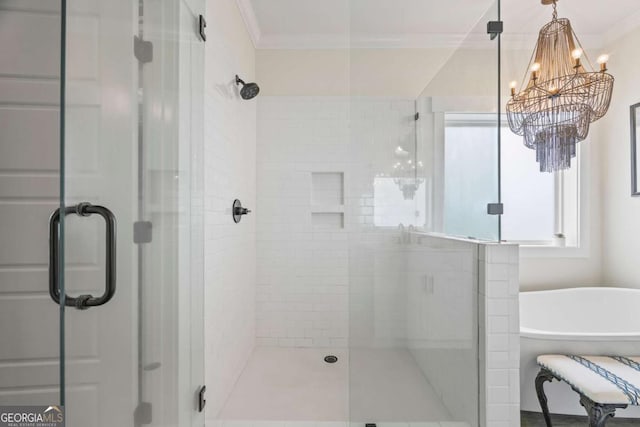 555 Red Bluff Dr, Athens, GA 30607 - full bath with a shower stall, a chandelier, a soaking tub, and crown molding