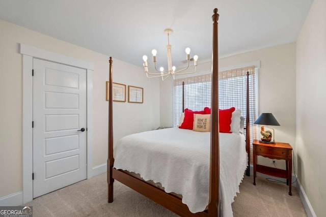 555 Red Bluff Dr, Athens, GA 30607 - carpeted bedroom featuring a chandelier and baseboards