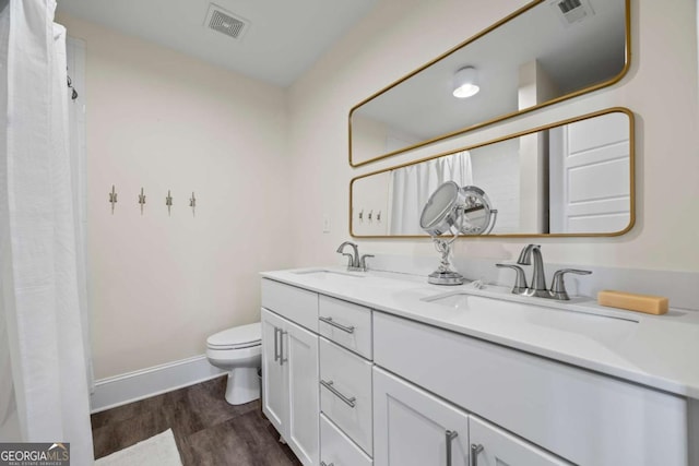 555 Red Bluff Dr, Athens, GA 30607 - bathroom with double vanity, wood finished floors, and a shower with shower curtain