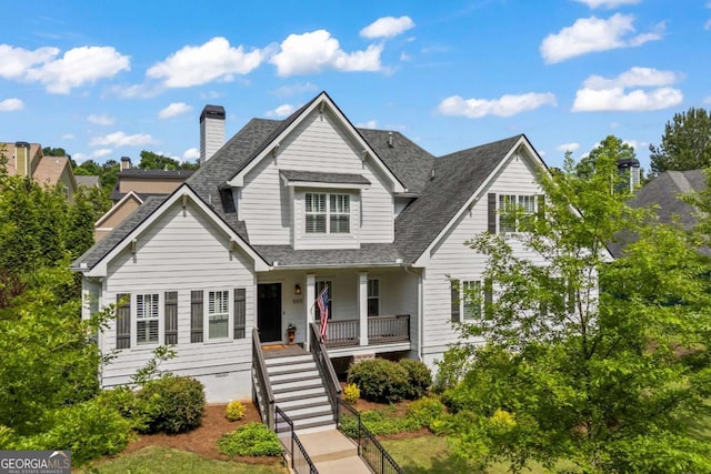 555 Red Bluff Dr, Athens, GA 30607 - traditional-style house featuring covered porch, a shingled roof, a chimney, and stairs
