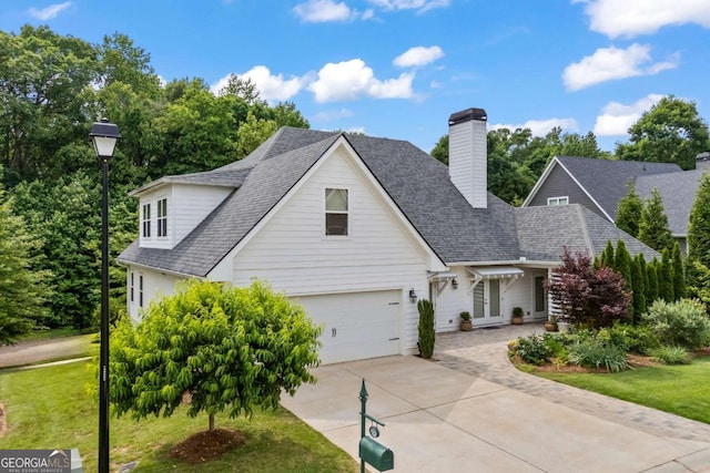 555 Red Bluff Dr, Athens, GA 30607 - traditional home featuring driveway, french doors, a front lawn, and a shingled roof