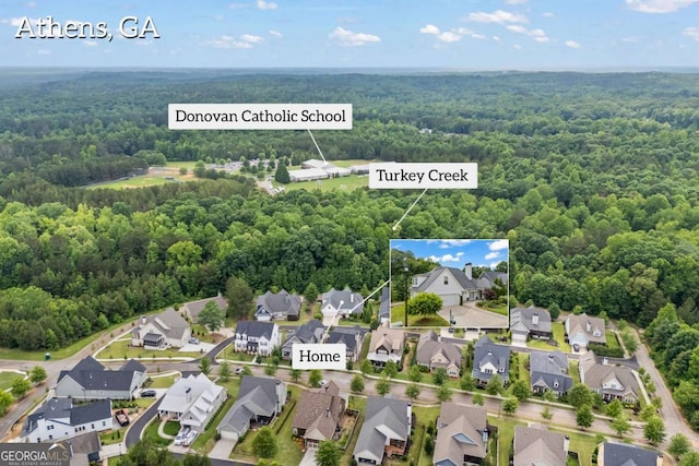 555 Red Bluff Dr, Athens, GA 30607 - aerial view of residential area with a heavily wooded area and property parcel outlined