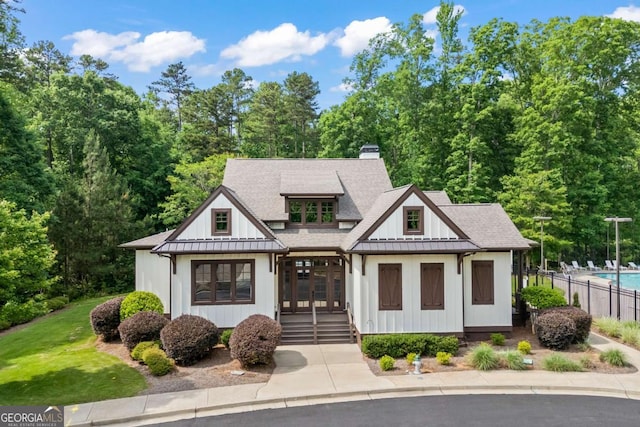 555 Red Bluff Dr, Athens, GA 30607 - modern inspired farmhouse with french doors, a chimney, a shingled roof, and board and batten siding