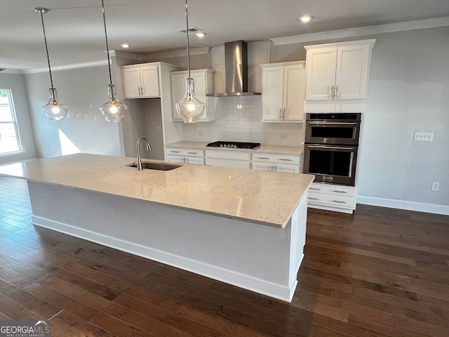 996 Layton Dr, Buford, GA 30518 - kitchen with wall chimney exhaust hood, stainless steel double oven, white cabinetry, a large island with sink, and backsplash