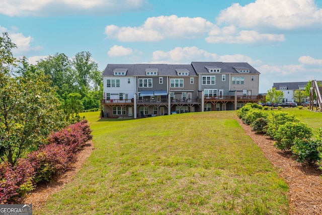 996 Layton Dr, Buford, GA 30518 - rear view of house with a yard and a wooden deck