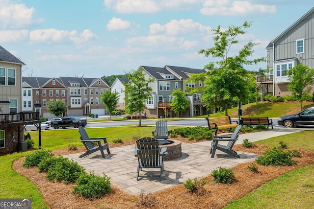 996 Layton Dr, Buford, GA 30518 - view of patio / terrace with an outdoor fire pit and a residential view