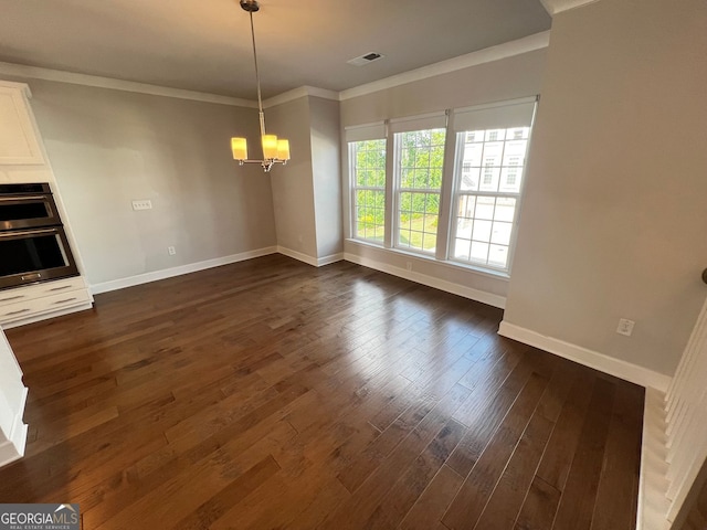 996 Layton Dr, Buford, GA 30518 - unfurnished dining area featuring a chandelier, crown molding, and dark wood-style flooring