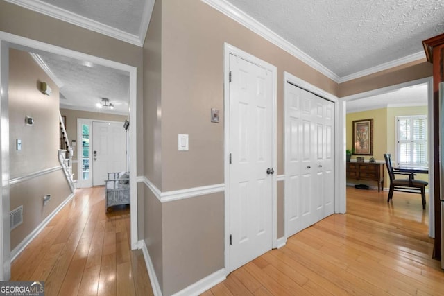 1769 Milford Creek Cts SW, Marietta, GA 30008 - hallway featuring a textured ceiling, light wood finished floors, and ornamental molding