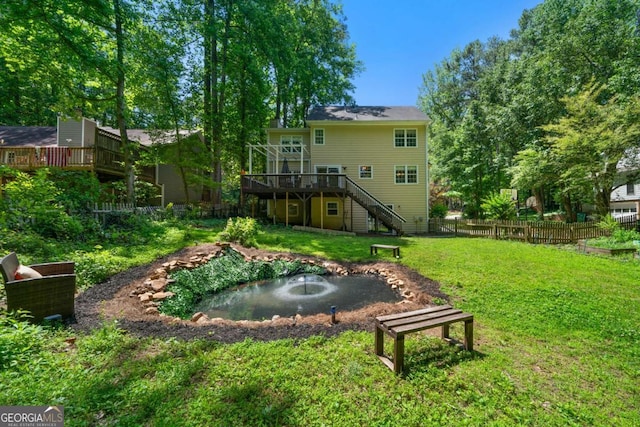 1769 Milford Creek Cts SW, Marietta, GA 30008 - view of yard featuring a garden pond, stairway, and a wooden deck