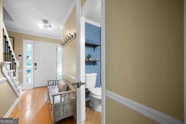 1769 Milford Creek Cts SW, Marietta, GA 30008 - foyer entrance featuring stairway, a textured ceiling, and ornamental molding