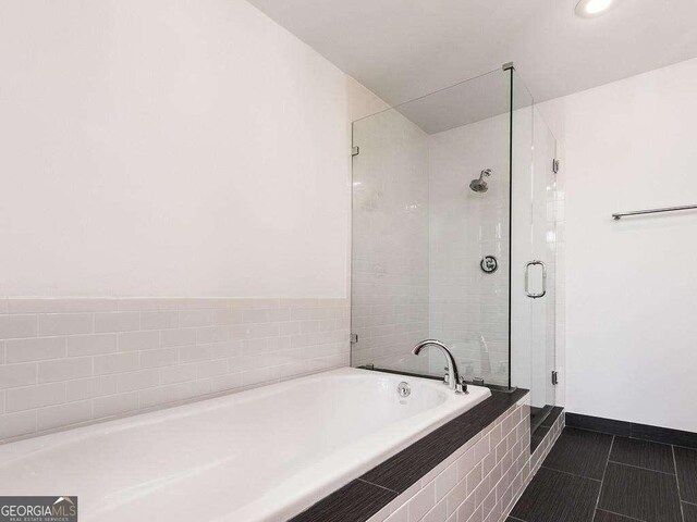 3235 Roswell Rd NE Unit 514, Atlanta, GA 30305 - bathroom with a bath, a shower stall, tile patterned flooring, baseboards, and recessed lighting