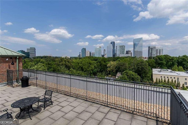 3235 Roswell Rd NE Unit 514, Atlanta, GA 30305 - view of patio / terrace featuring a view of skyline and view of scattered trees