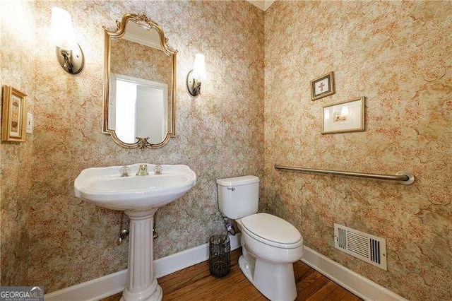 1021 Oakpointe Pl, Dunwoody, GA 30338 - bathroom with wood finished floors and toilet