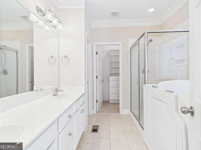 1090 Lane Creek Cir, Bishop, GA 30621 - full bathroom with a stall shower, double vanity, tile patterned flooring, ornamental molding, and a walk in closet