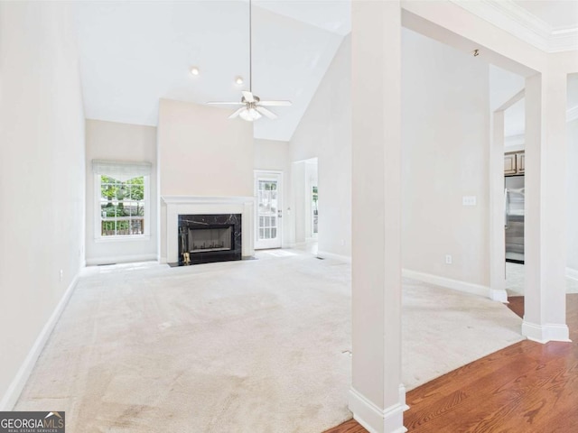 1090 Lane Creek Cir, Bishop, GA 30621 - unfurnished living room featuring a ceiling fan, a fireplace, baseboards, high vaulted ceiling, and carpet floors