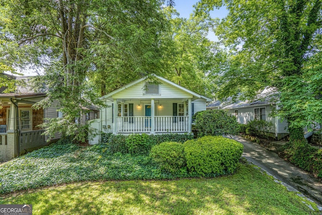 1311 Sylvan Cir, Brookhaven, GA 30319 - bungalow-style house featuring a porch and a front lawn