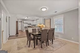 1311 Sylvan Cir, Brookhaven, GA 30319 - dining room featuring crown molding and baseboards