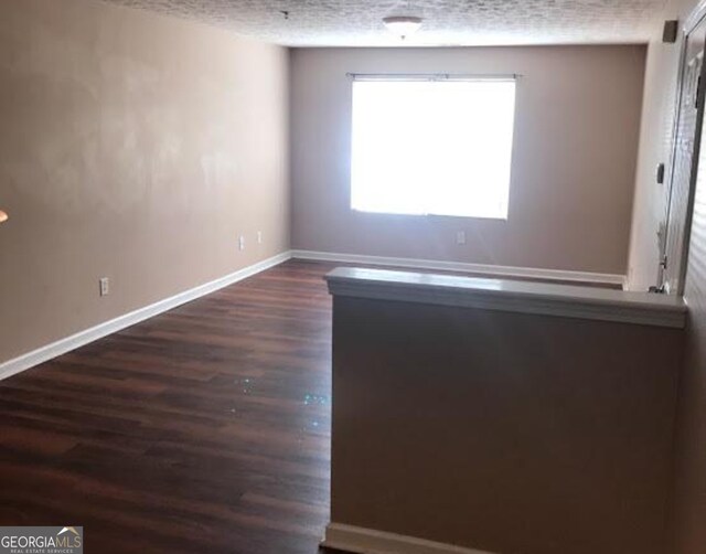 18101 Waldrop Cv, Decatur, GA 30034 - empty room with baseboards and dark wood finished floors