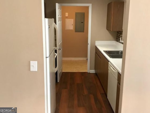 18101 Waldrop Cv, Decatur, GA 30034 - kitchen with electric panel, white appliances, dark wood-type flooring, light countertops, and baseboards