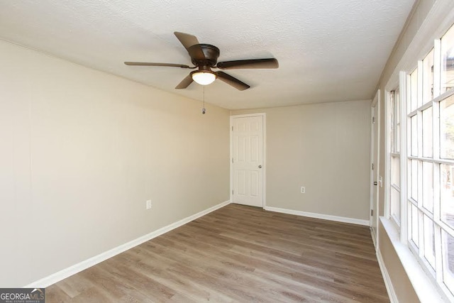 272 Old Sudie Rd, Hiram, GA 30141 - empty room featuring ceiling fan, light wood-type flooring, and a textured ceiling