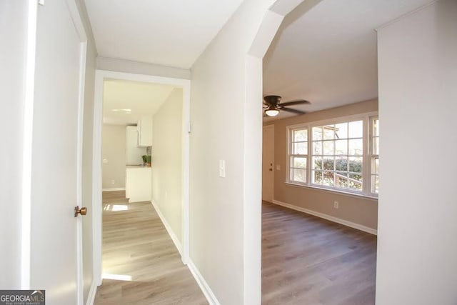 272 Old Sudie Rd, Hiram, GA 30141 - hallway featuring light wood-type flooring and arched walkways