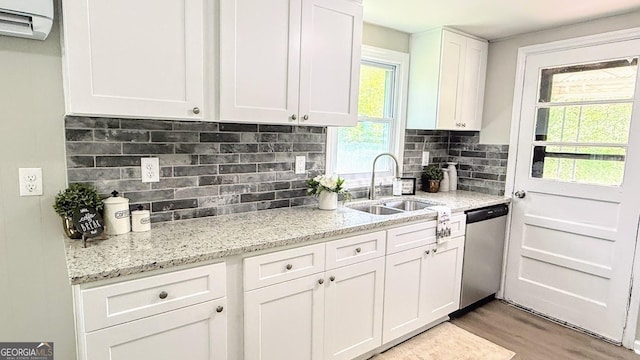 272 Old Sudie Rd, Hiram, GA 30141 - kitchen featuring dishwasher, white cabinets, light wood finished floors, a wall mounted AC, and backsplash