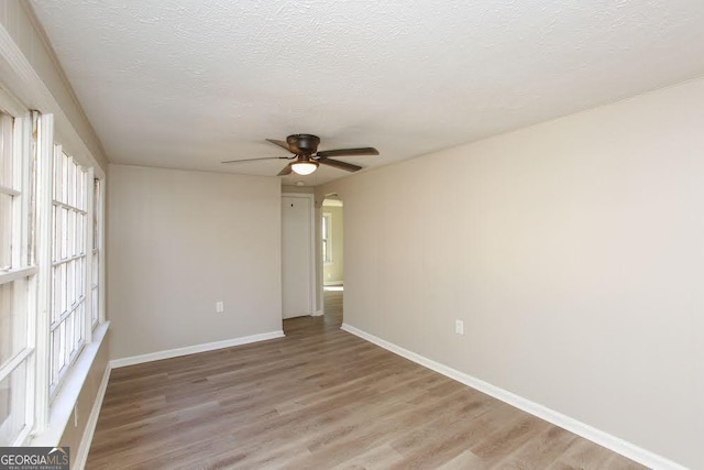 272 Old Sudie Rd, Hiram, GA 30141 - spare room featuring a ceiling fan, light wood finished floors, and a textured ceiling