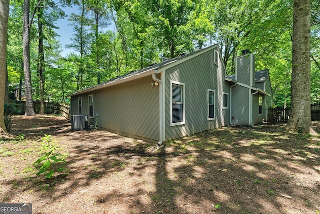2041 Kramer Way, Marietta, GA 30062 - view of side of property with central AC and a chimney
