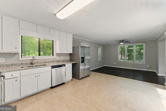 2041 Kramer Way, Marietta, GA 30062 - kitchen with appliances with stainless steel finishes, a sink, ceiling fan, white cabinetry, and crown molding