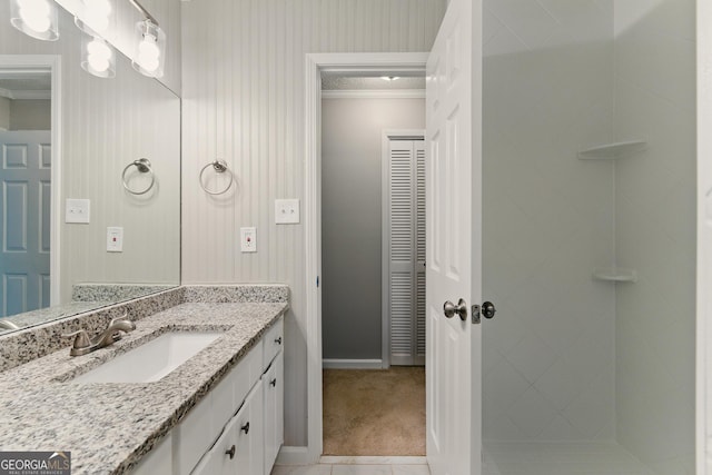 2041 Kramer Way, Marietta, GA 30062 - bathroom featuring vanity, ornamental molding, a shower stall, and baseboards