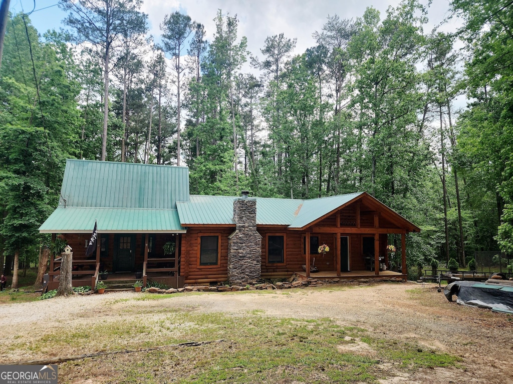 130 Greenock Cv, Toccoa, GA 30577 - view of front of home featuring covered porch, a chimney, metal roof, and log exterior