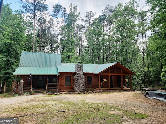 130 Greenock Cv, Toccoa, GA 30577 - view of front of home featuring covered porch, a chimney, metal roof, and log exterior