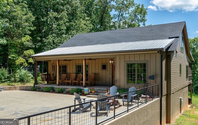 724 Bertha Willis Rd, Carlton, GA 30627 - view of front of property featuring board and batten siding, a patio, ceiling fan, and a shingled roof