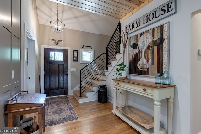 724 Bertha Willis Rd, Carlton, GA 30627 - entrance foyer featuring stairs, light wood-style floors, a chandelier, and wooden ceiling
