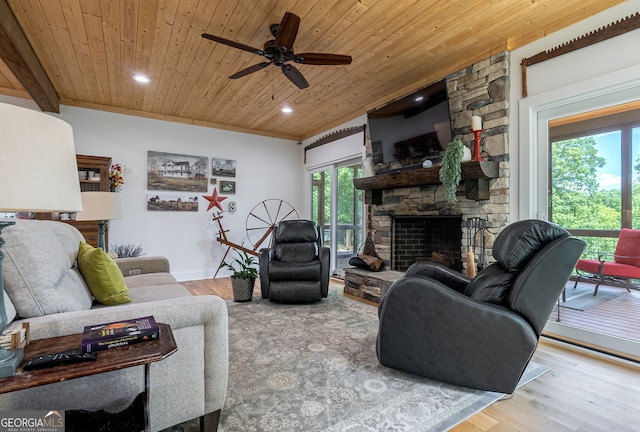 724 Bertha Willis Rd, Carlton, GA 30627 - living room with wooden ceiling, wood finished floors, a ceiling fan, a fireplace, and recessed lighting