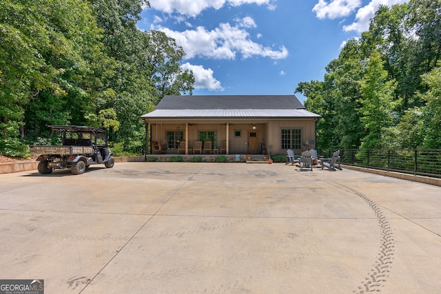 724 Bertha Willis Rd, Carlton, GA 30627 - view of front facade featuring board and batten siding, covered porch, and driveway