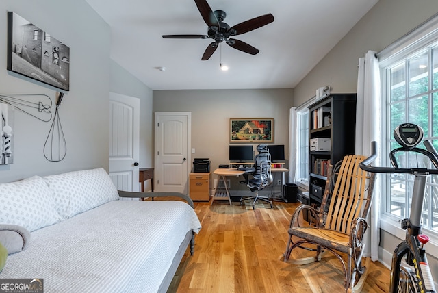724 Bertha Willis Rd, Carlton, GA 30627 - bedroom featuring light wood finished floors, a desk, and ceiling fan