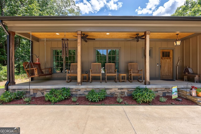 724 Bertha Willis Rd, Carlton, GA 30627 - doorway to property featuring board and batten siding, a ceiling fan, a patio, and a porch