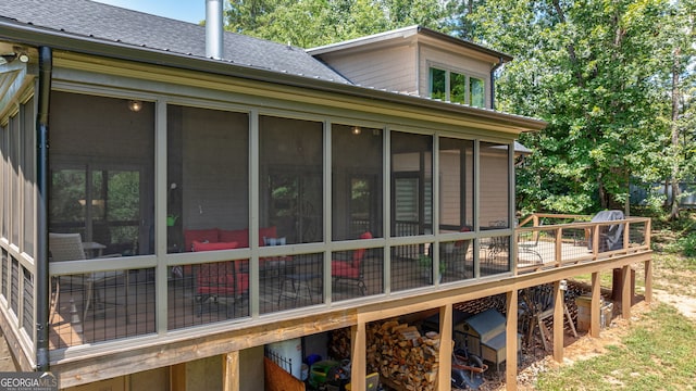 724 Bertha Willis Rd, Carlton, GA 30627 - view of side of home featuring a sunroom, a shingled roof, and a wooden deck