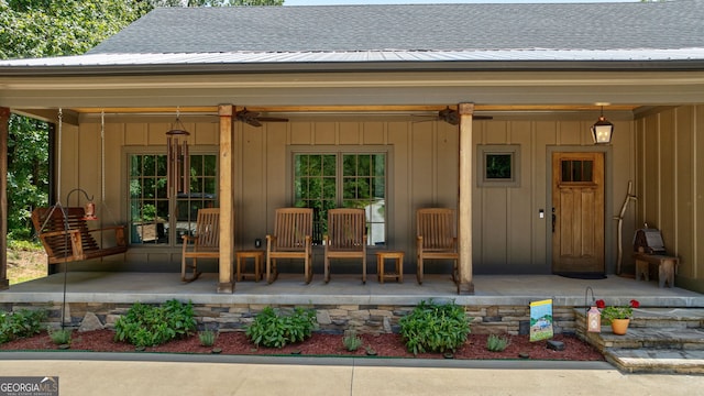 724 Bertha Willis Rd, Carlton, GA 30627 - entrance to property featuring roof with shingles, board and batten siding, a patio, and ceiling fan
