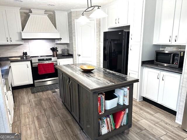 724 Bertha Willis Rd, Carlton, GA 30627 - kitchen featuring custom exhaust hood, stainless steel appliances, dark countertops, open shelves, and wood tiled floors